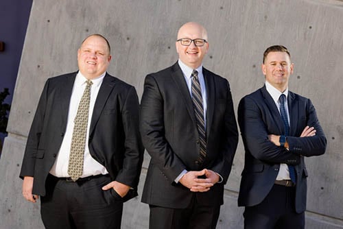 Attorneys Thomas Brown, Joshua Ernst and Allan Draper